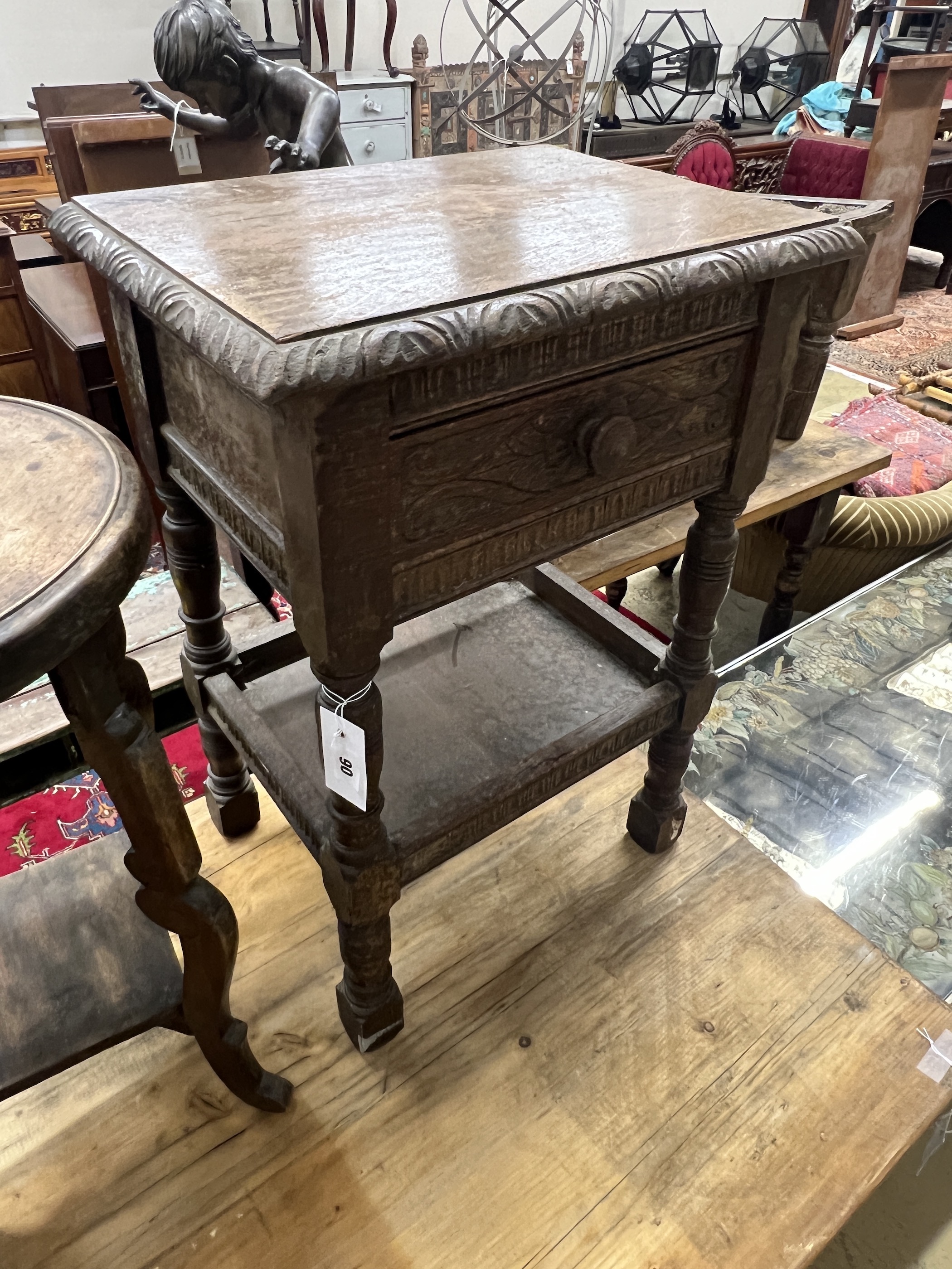 A 17th century style oak two tier occasional table together with a circular occasional table, larger width 43cm, height 63cm